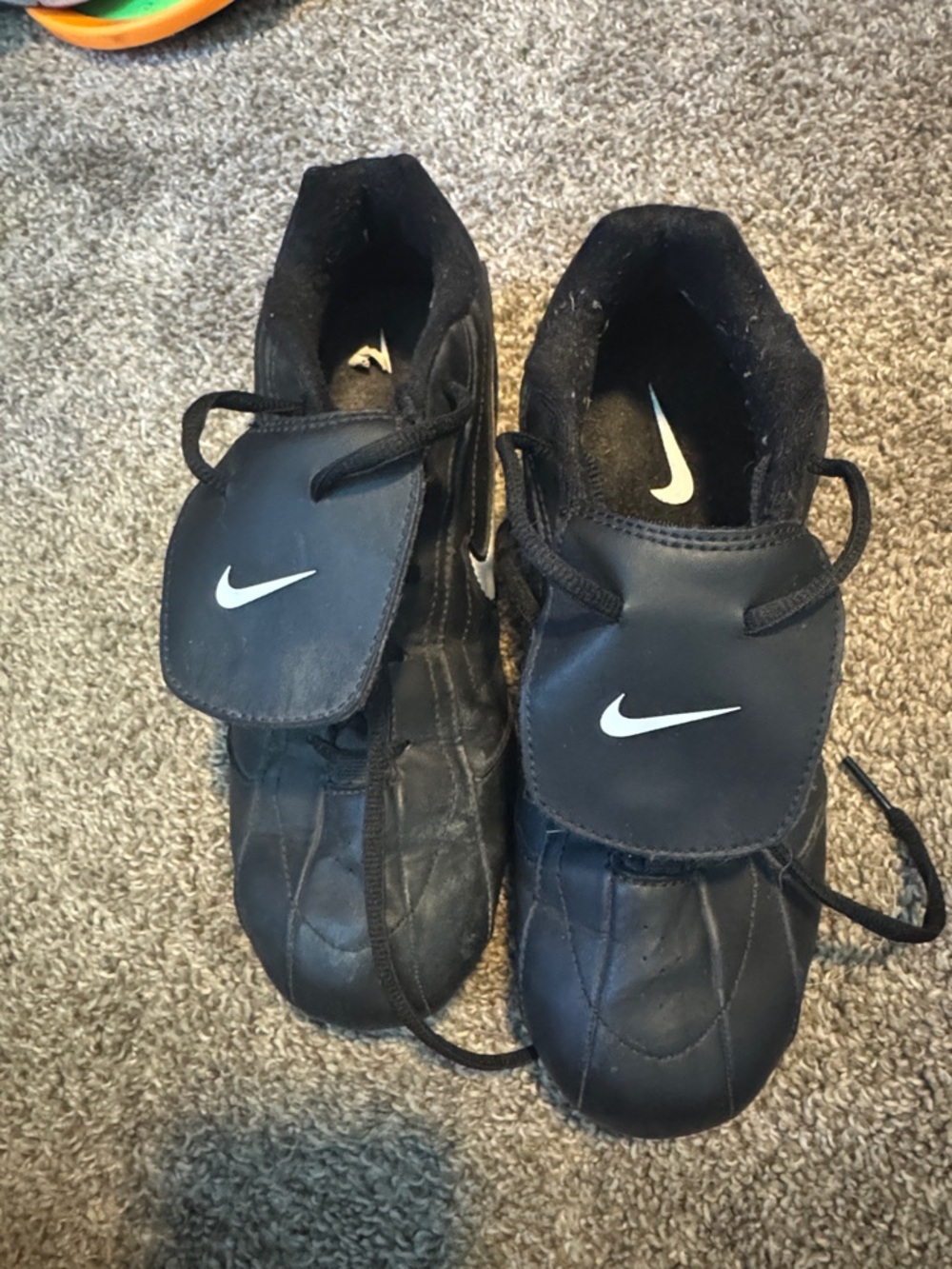 Nike Black Cleats with White Swoosh